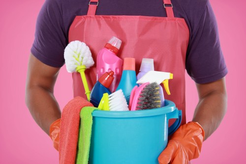 Specialist sofa cleaning equipment used on a modern sofa in a Clapham home