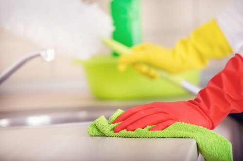 Staff managing slip risks during carpet cleaning work